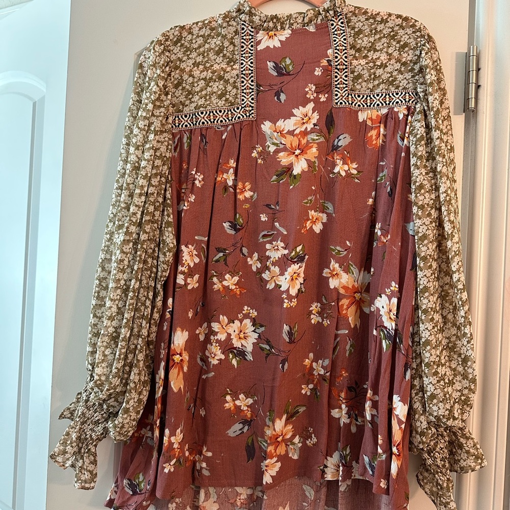 New with tags, multiple sizes, great fall print blouse